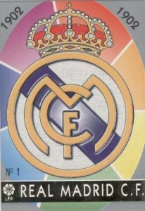Las fichas de la Liga 97-98. Nº 1. Escudo del Real Madrid C.F. (Real Madrid C.F.). Editorial Mundicromo.